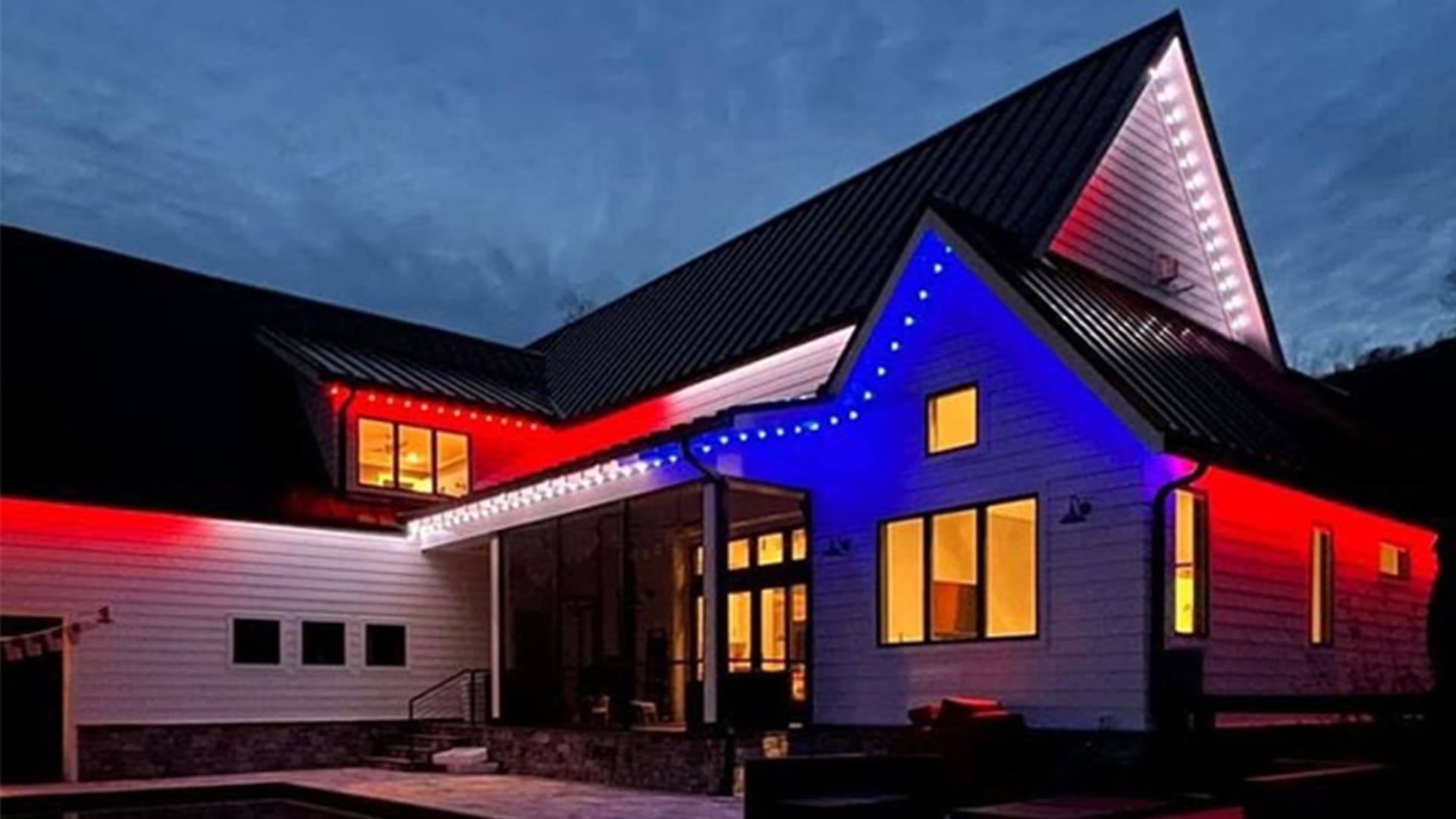 Colorado home decorated with permanent LED holiday lighting for 4th of July.