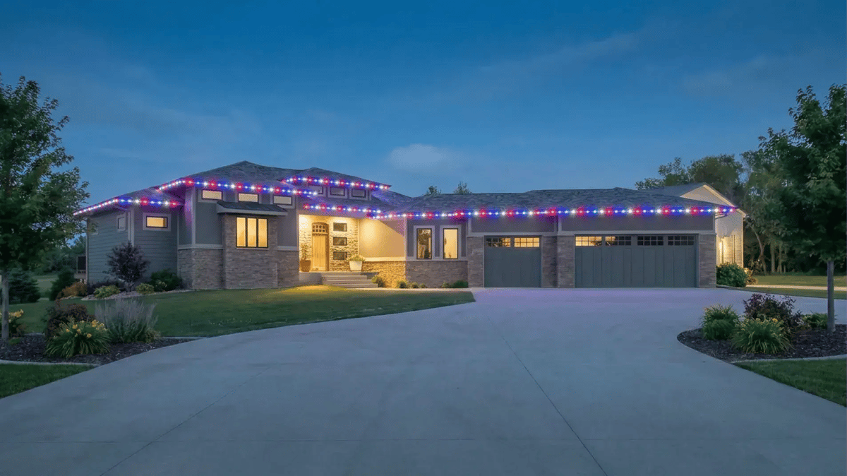 Permanent roofline lighting in patriotic colors on a Colorado home