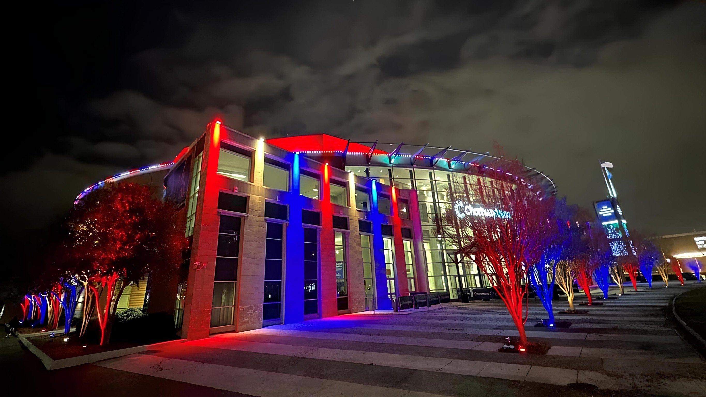Red and blue permanent architectural lighting on a commercial building