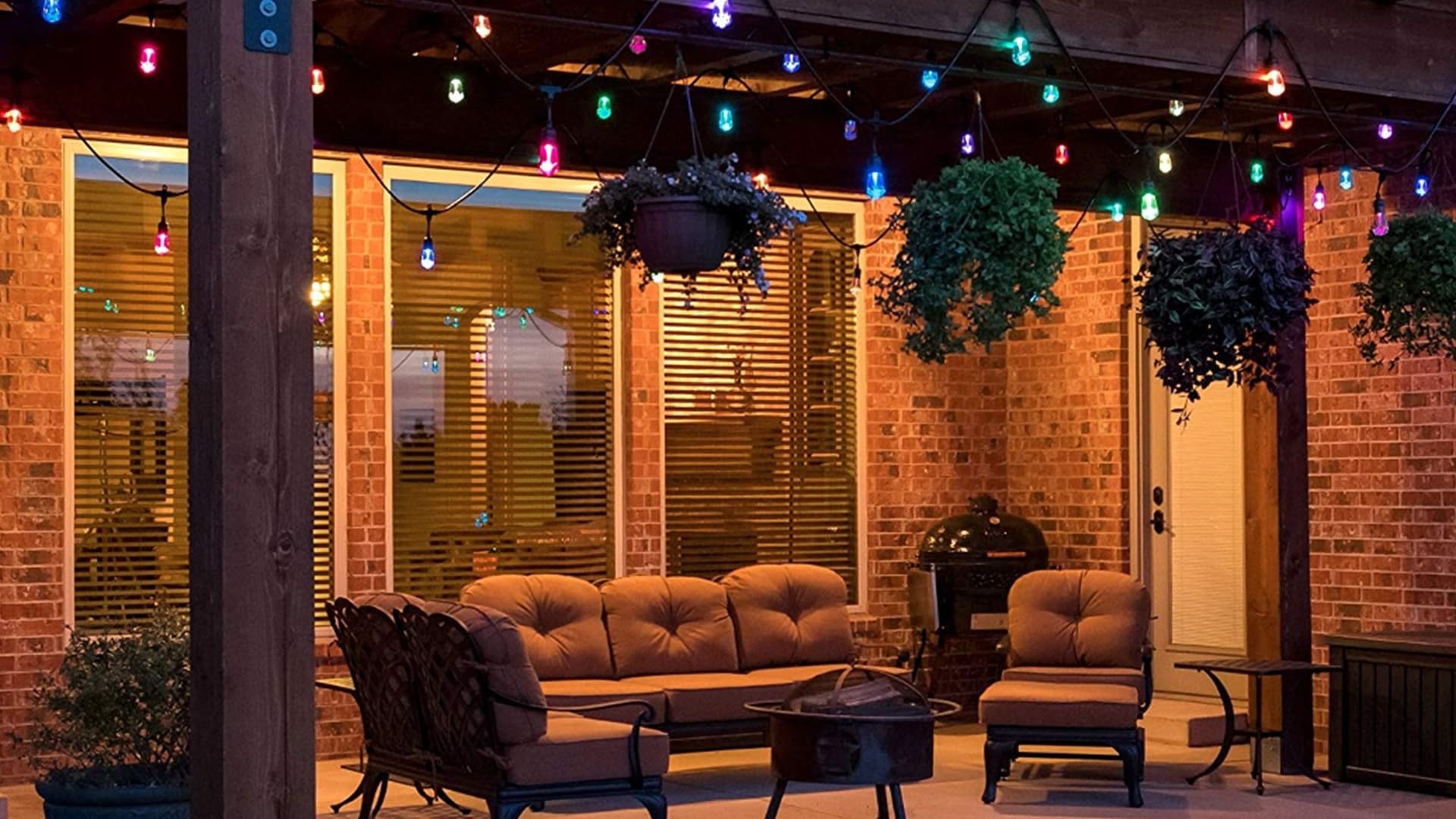 Permanent accent lighting illuminating a covered outdoor living space