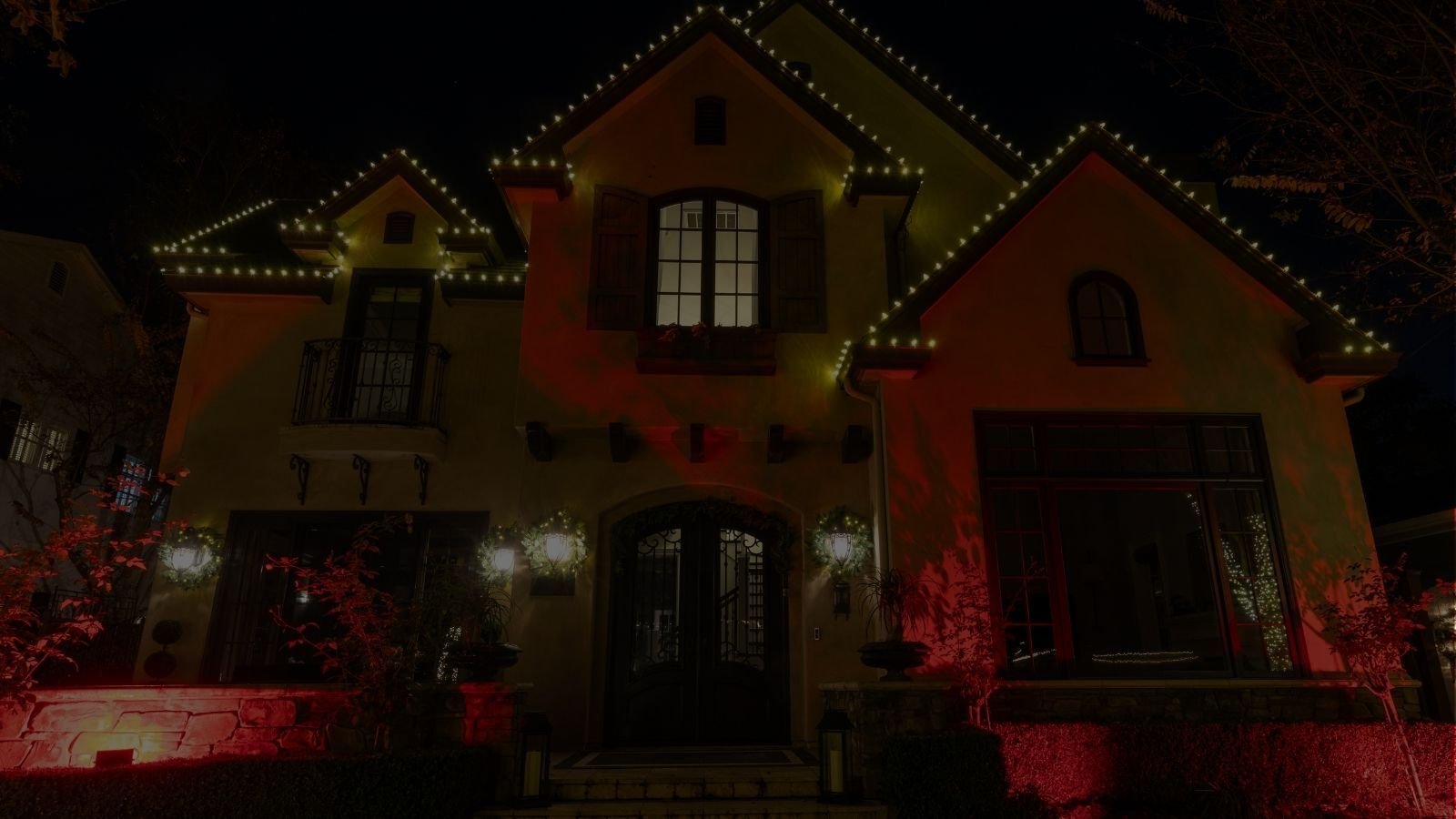 Permanent outdoor lighting installation on a modern Denver home with architectural accent lighting