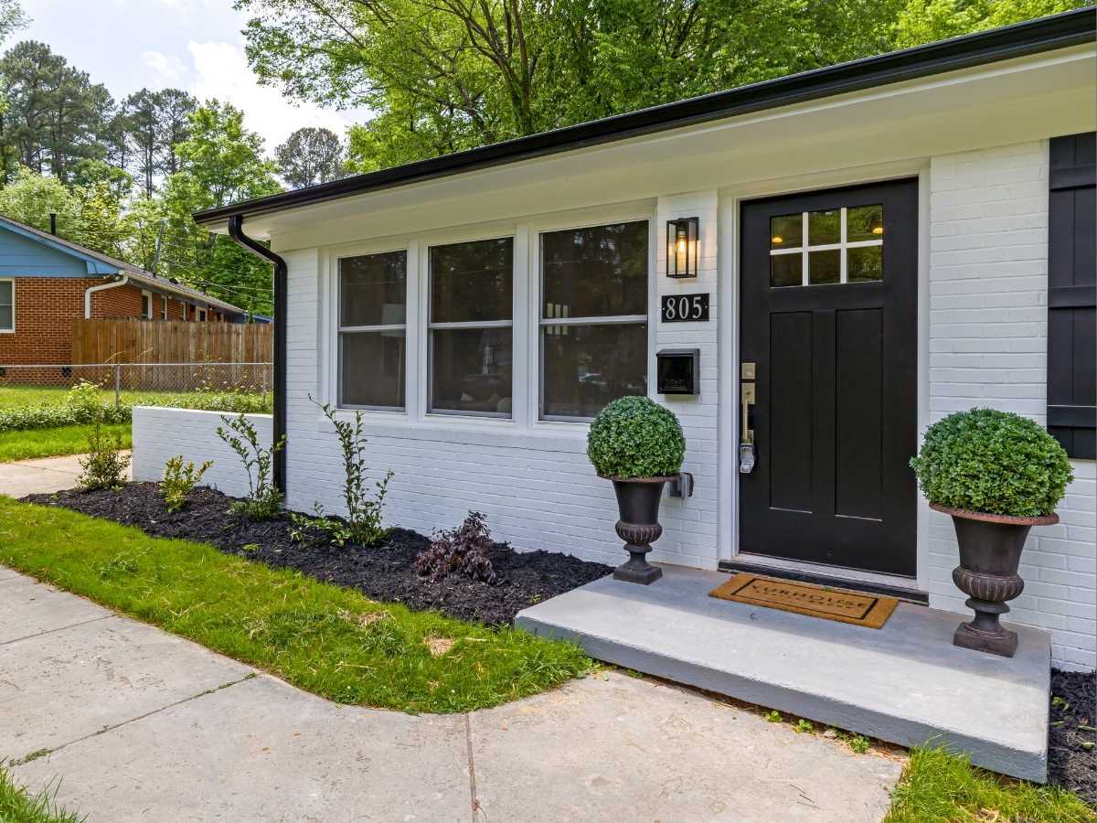 Exterior home improvements including windows, front door, exterior painting and outdoor lighting