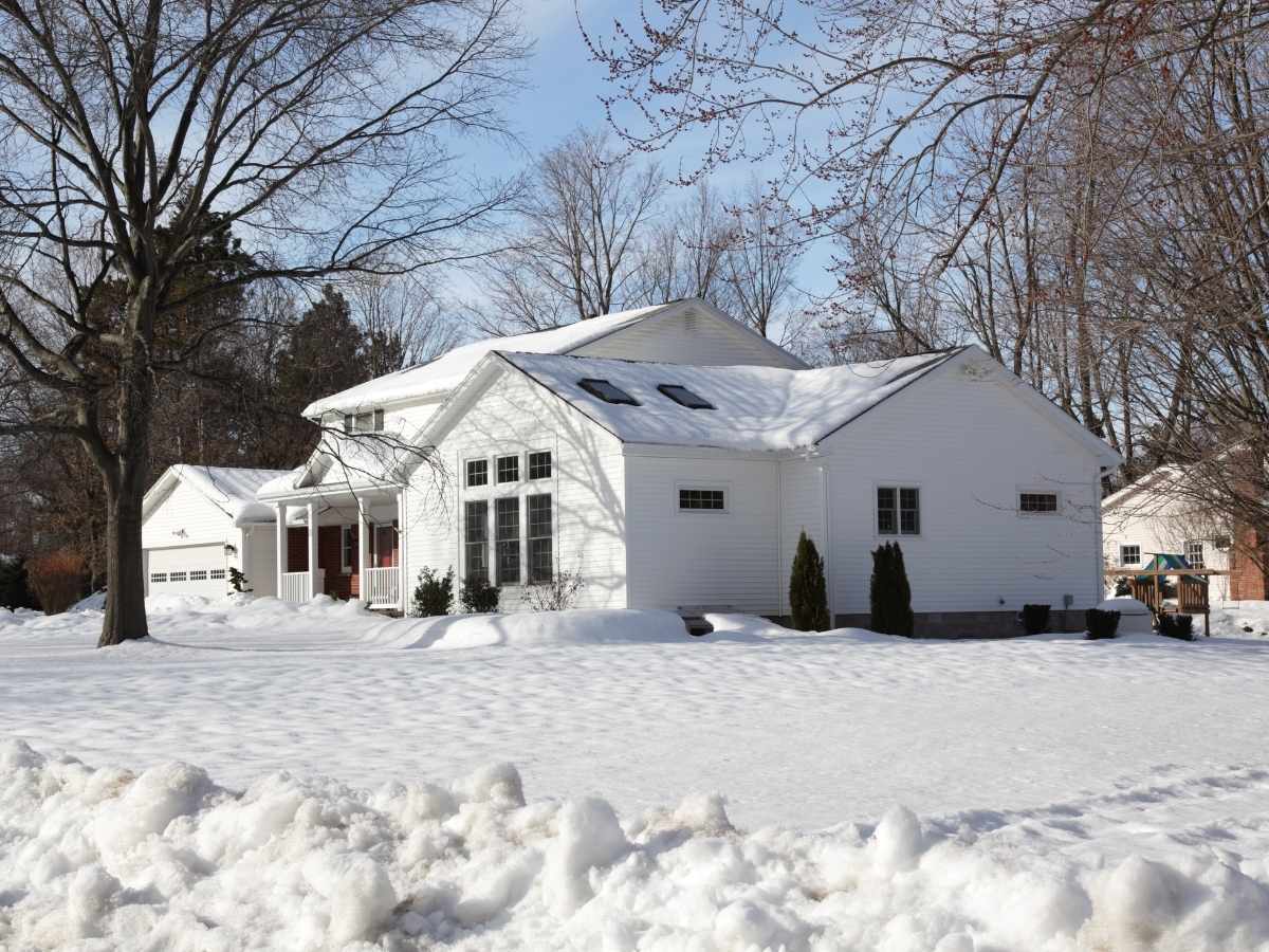 Home exterior in winter snow illustrating Colorado weather conditions